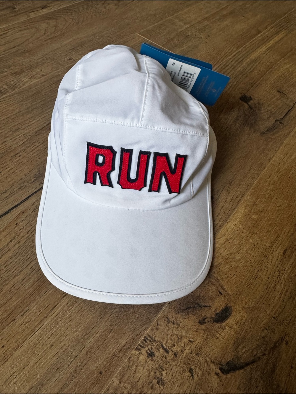 Brooks White Baseball Cap with Red 'RUN' Patch